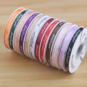 1cm satin ribbon rolls with printed text, ideal for flower bouquet gift wrapping and DIY crafts.