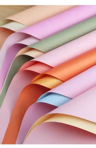 Detail shot of colorful dual-color floral wrapping paper rolls for DIY bouquet arrangements.