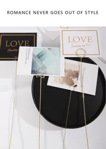 Metal floral card holder detail, golden wire memo pick for bouquet packaging and gift decoration.