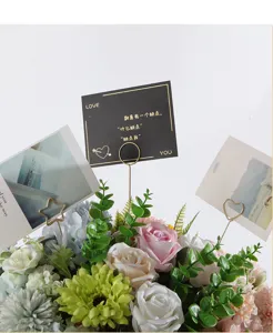 Metal floral card holder detail, heart and star shape clips for beautiful bouquet packaging.