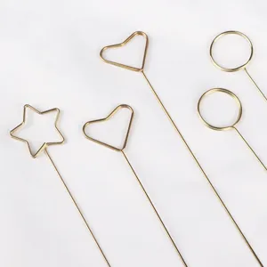 Metal flower card holders golden wire picks for bouquet packaging and floral arrangement supplies.