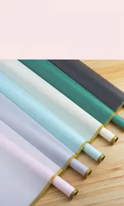 Detailed close-up of colorful waterproof jelly film flower wrapping paper rolls with gold edge.