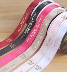 Polyester gold stamping ribbon rolls with love text for gift wrapping, floral and cake decor.