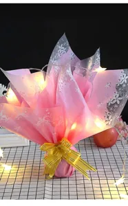 Waterproof floral wrapping paper matte pink bouquet wrap with fairy lights for gifts