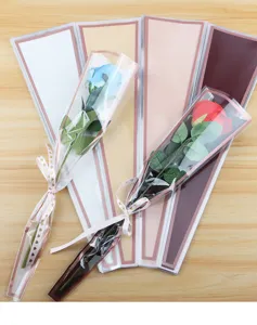 Waterproof OPP plastic single rose bouquet packaging bags with exquisite gold edge detail.