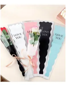 Detailed view of mermaid-shaped single rose packaging bags with transparent design and insert cards.