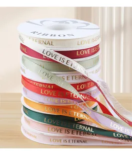 1cm gold foil stamped ribbon for DIY handmade bouquets, gift wrapping, and floral decorations.
