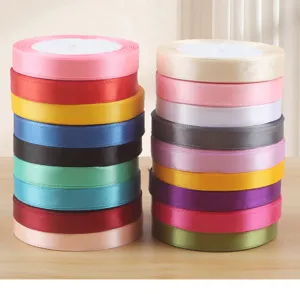 Colorful satin ribbon rolls for gift wrapping, flower bouquet packaging, and DIY crafts.