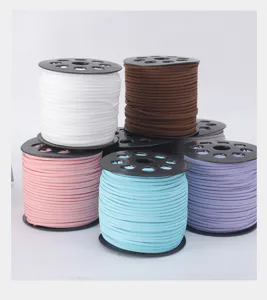 Detailed view of colorful faux suede cord spools, perfect for floral gift wrapping crafts.