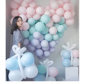 Colorful macaron latex balloons for party decoration, soft pastel tones detail view.