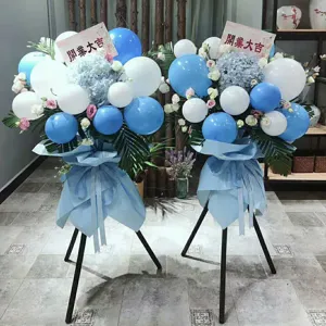 Grand opening decorative balloon flower stand set with blue and white balloons for celebration.