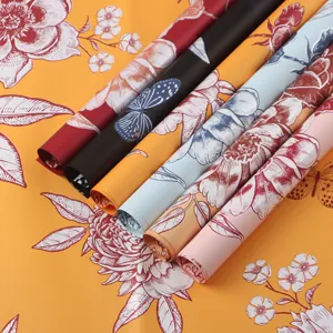Waterproof floral wrapping paper rolls with beautiful butterfly and flower prints for bouquets.