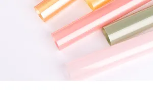 Detail shot of colorful translucent wrapping paper rolls for flower bouquets and crafts.