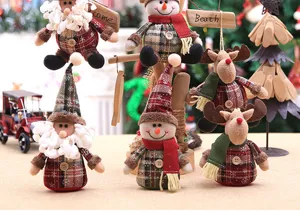 Detailed group shot of Christmas knit plush ornaments including Santa, snowman, and reindeer.