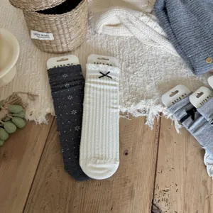 Women knitted stack socks with cute bowknot design, cozy high-intelligence grey style winter socks.