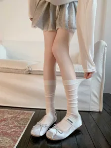 Comfortable women's mid-calf socks featuring a classic ribbed design for daily wear and spring outfits.