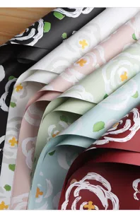 Detailed view of thick floral wrapping paper rolls in multi colors with elegant brush flower print.