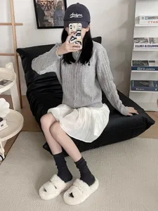 Korean style cozy retro grey cardigan with white skirt, dark grey mid tube socks and slippers.