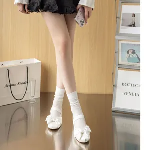 Detail view of women's summer breathable hollow out mid tube socks in stylish design.