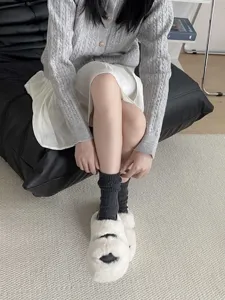 Cozy dark gray wool knit mid-calf slouch socks for women, thick and warm winter sock style.