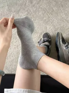 Detail view of women summer thin grey short socks, showing soft ribbed stretch fabric.