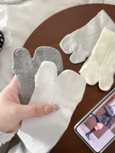 Close up detail of breathable split toe socks for women, thin mesh design, comfortable.