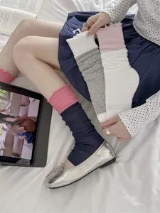 Detail view of Korean ballet style colorblock frilly leg warmers, breathable thin cotton.