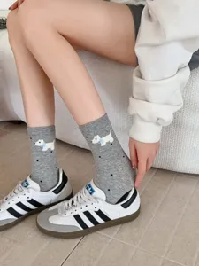 Grey mid-tube cotton socks featuring cute puppy and polka dot patterns, soft and cozy detail view.