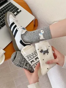 Detailed view of cute puppy pattern and bow design on Korean style cotton socks.