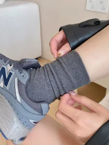 Grey ribbed cotton stacking socks detail view, comfortable mid-tube daily wear pairing shot.