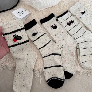 Cute women mid-tube socks with colorful speckle yarn, cat cartoon embroidery, cozy details.
