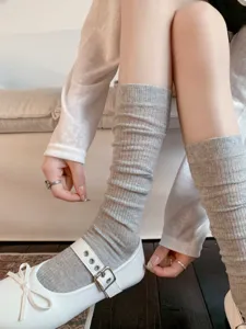 Grey ribbed mid-calf socks detail shot, soft knitted college style casual hosiery footwear.