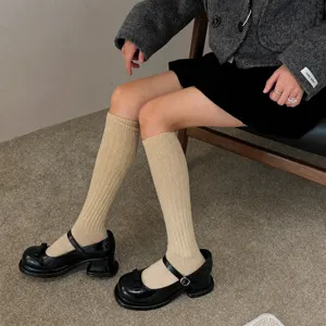 Cozy knit knee high socks for women, thick warm winter tube socks, casual daily wear.