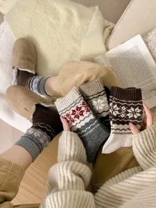 Detailed view of cozy winter wool blend socks featuring classic retro Fair Isle patterns.