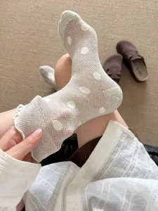 Sheer white polka dot mesh mid-tube socks for women, breathable summer ruffle design.
