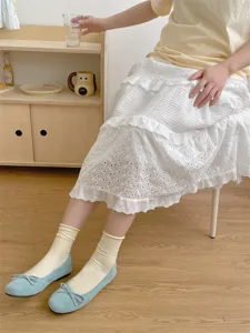 Details view of women's solid color mid-tube ribbed cotton socks, soft and breathable.