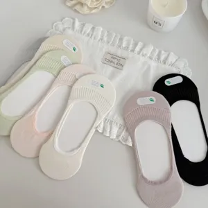 Detailed view of women's shallow invisible breathable socks in multiple solid colors.