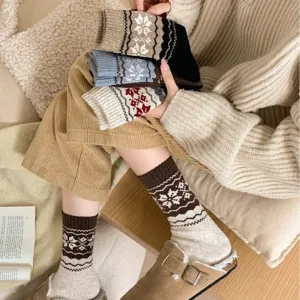 Women's vintage Fair Isle thermal wool mid-tube socks, cozy winter snow pattern design.