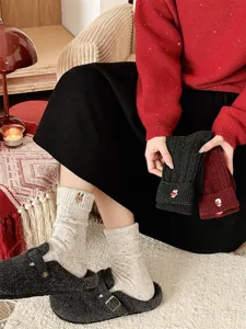 Thick wool Christmas socks for women with cute embroidery, flecked yarn, and warm mid-tube design.