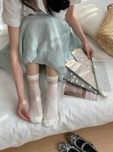 Breathable women mesh mid-tube socks with cute polka dots and bowknot design for spring summer.