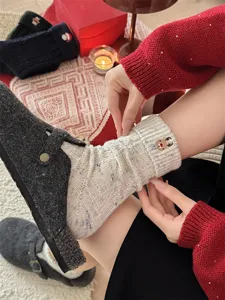 Warm wool Christmas socks for women with cute reindeer embroidery and cozy turned cuffs.