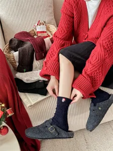 Women's thick wool Christmas mid-tube socks with cute embroidery and cozy winter warmth.