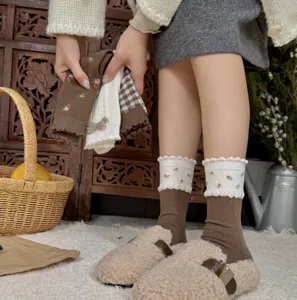 Cozy floral ruffle slouch socks with soft wool blend and delicate lace trim for winter.