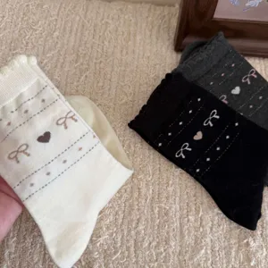 Korean style women mid-tube socks with cute heart and bow knit patterns, soft and cozy.