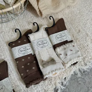 Detailed view of mulberry silk wool blend stack socks set with cozy cable knit and cute floral patterns.