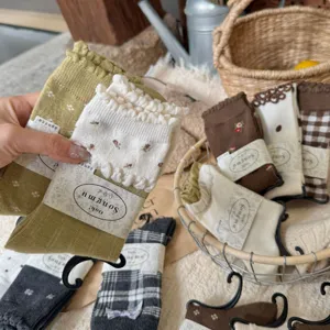 Detailed shot of cozy woolen blend ruffle socks with delicate patterns in a lifestyle setting.