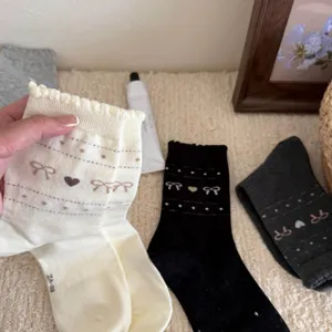 Korean style women's cotton mid tube socks with lovely bow and heart patterns, ruffle cuff.