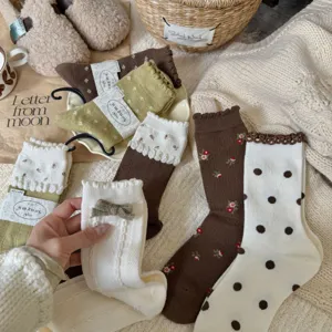Cozy knit stacking socks with cute floral embroidery and polka dots for women daily wear.