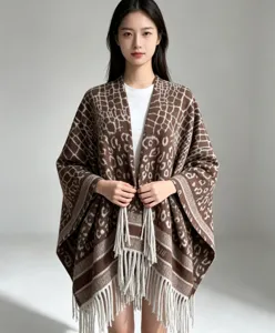 Stylish women's brown leopard knit cape shawl with fringe hem, open front fashion outerwear for daily wear.