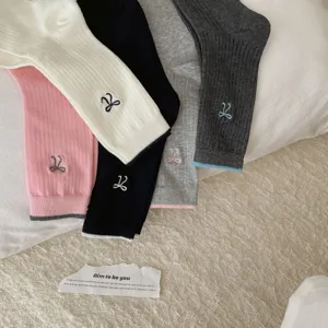 Korean style cute bow embroidered stacking socks for women, soft cotton knit fashion hosiery.